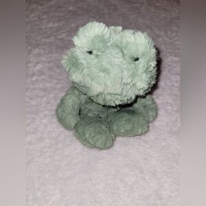 Adorable Jellycat Squiggle Frog plush in a soft sage green color 🐸